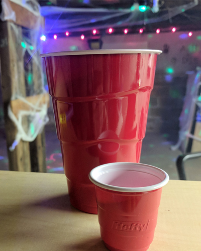 red plastic party cups at a warehouse rave