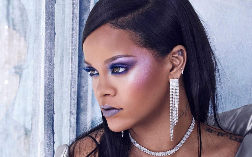 rihanna wearing frost purple makeup and ice jewelry by cold window
