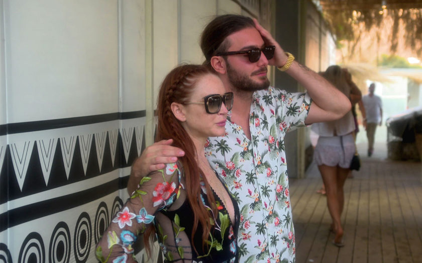 Lindsay Lohan poses with Alesso for a photograph