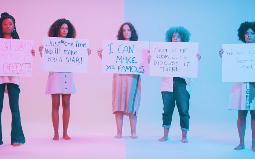 screenshot from famoso music video women holding hand written signs saying I can make you famous