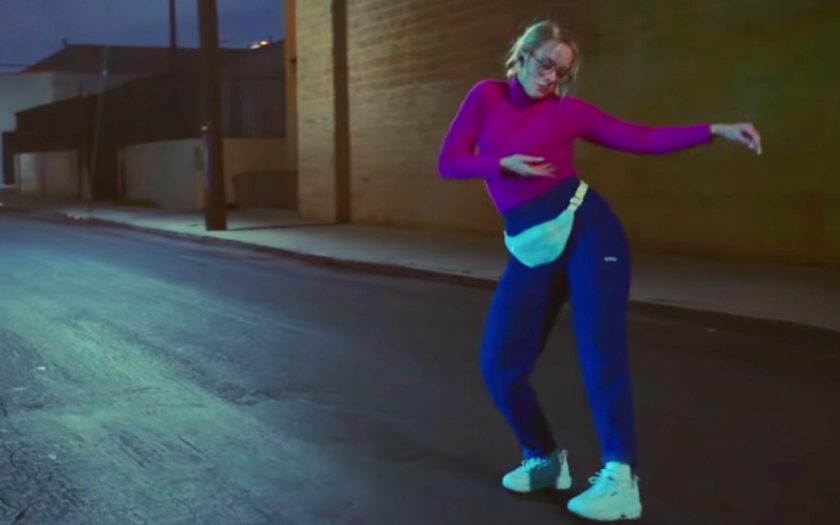 nerdy blonde woman dances in every day music video