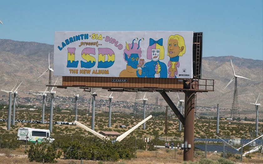 LSD the album billboard in Coachella Valley with giant fans in background
