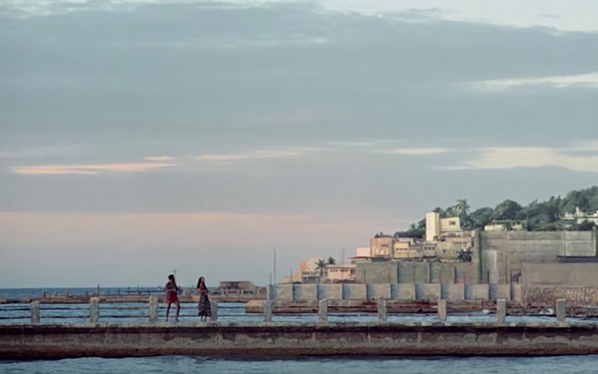 screenshot from guava island donald glover and rihanna on a dock as seen from a distance