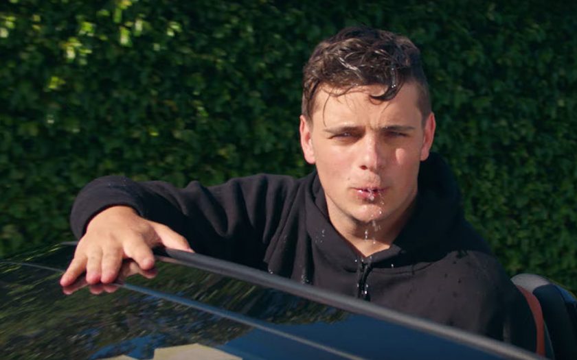 martin garrix in a convertible sweating profusely