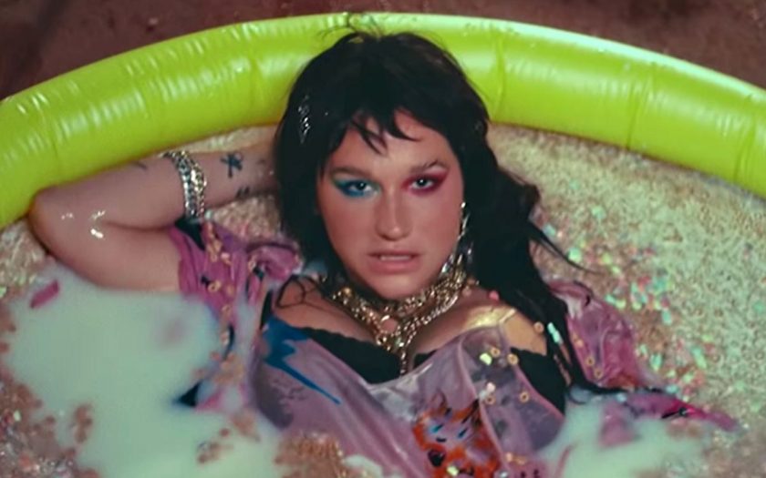 kesha in a kiddie pool full of milk and marshmallow cereal