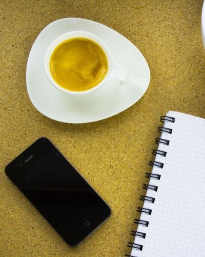 expresso, smartphone and notebook from above