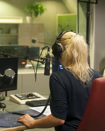 blond woman producing audio